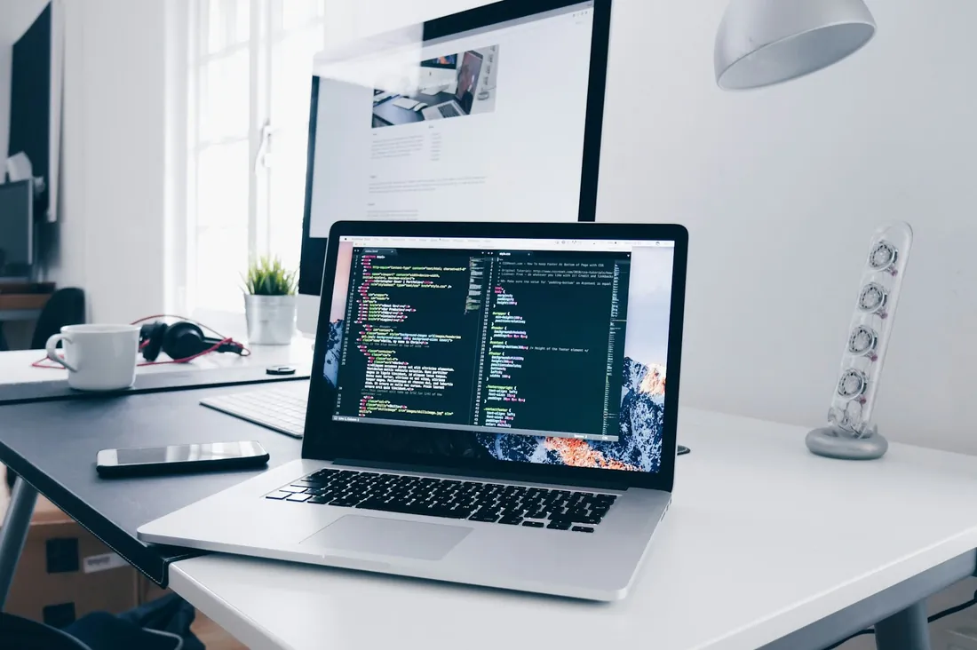 The studio desk — a MacBook mid-build